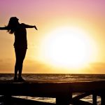 Silhouette Photo of Woman Against during Golden Hour